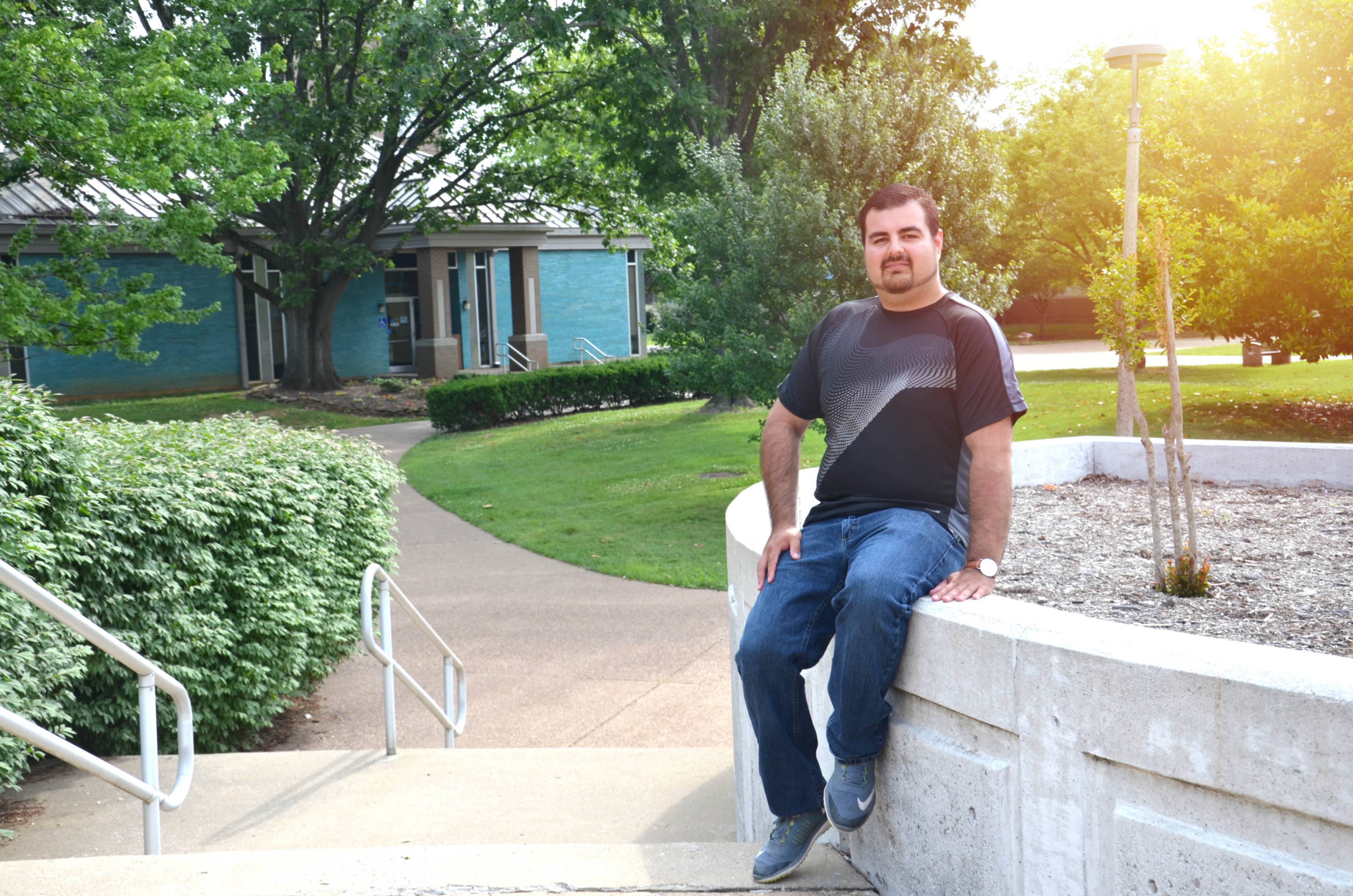 Guy outside looking at the camera smiling