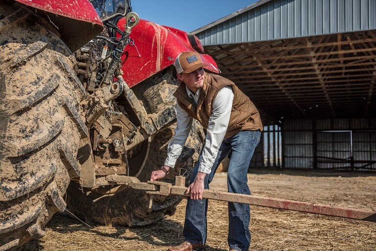 guy working on tractor