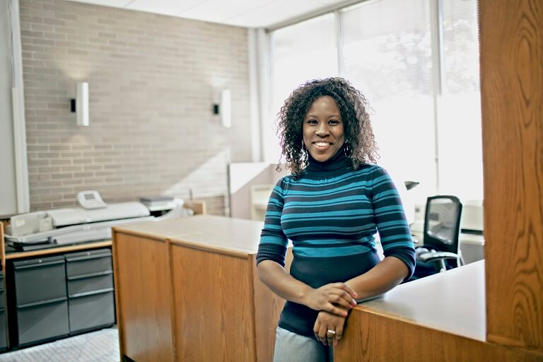 woman standing at office desk